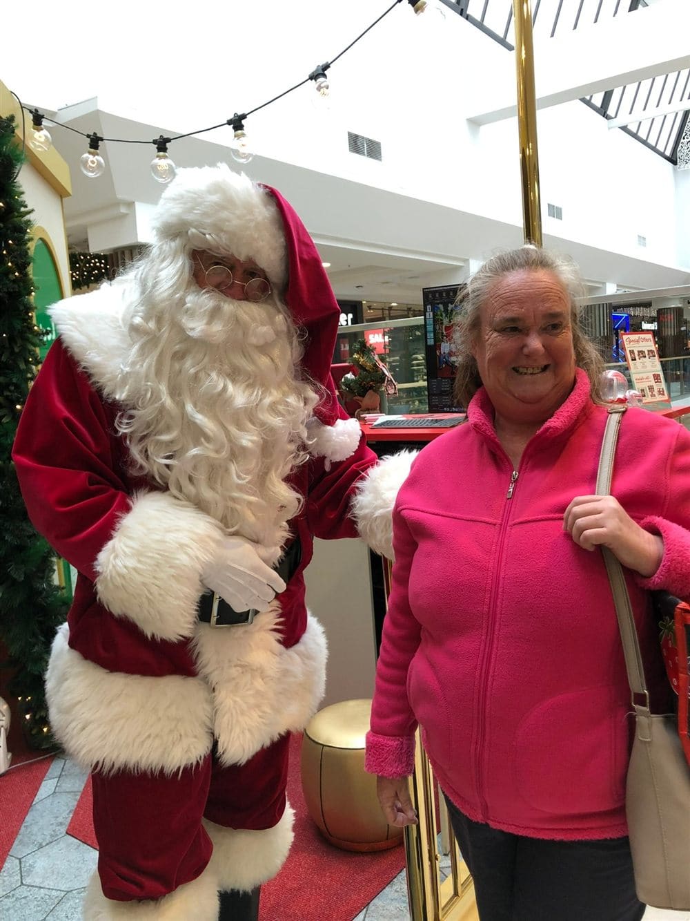 A participant sharing a laugh with Santa at the local shopping centre